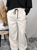 Pantalone bianco fasce nere